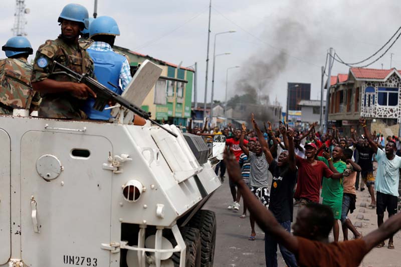Residents chant slogans against Congolese President Joseph Kabila as peacekeepers serving in the United Nations Organisation Stabilisation Mission in the Democratic Republic of the Congo (MONUSCO) patrol during demonstrations in the streets of the Democratic Republic of Congo's capital Kinshasa, on Tuesday, December 20, 2016. Photo: Reuters