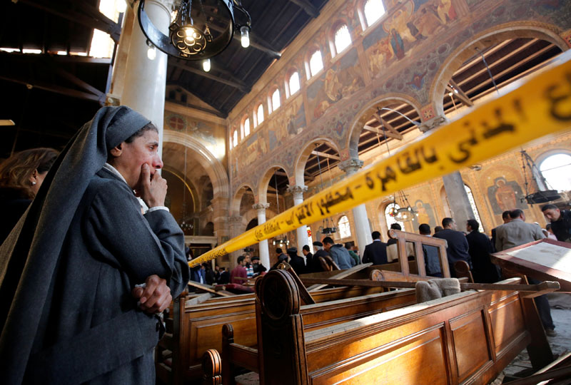 A nun cries as she stands at the scene inside Cairo's Coptic cathedral, following a bombing, in Egypt on December 11, 2016. Photo: Reuters