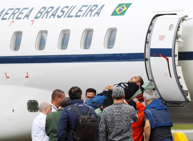 Alan Ruschel, player of Brazilian soccer team Chapecoense, is being loaded into a plane of Brazilian's Air Force for his return to Brazil, after he survived a plane crash with his teammates aboard, in Rionegro, Colombia. Photo: Reuters