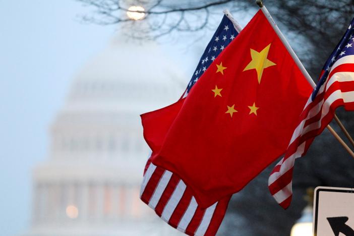 The People's Republic of China flag and the U.S. Stars and Stripes fly along Pennsylvania Avenue near the U.S. Capitol during Chinese President Hu Jintao's state visit in Washington, DC, U.S. on January 18, 2011. REUTERS/Hyungwon Kang/File Photo