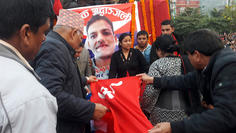 CPN-UML Deputy General Secretary duo Bishnu Paudel and Ghanashyam Bhushal pay tribute to the Chairman of the CPN-UML-aligned Youth Association Nepalu2019s Rupandehi chapter, Durga Tiwari, in Butwal Sub-Metropolitan City of Rupandehi district, on Wednesday, December 21, 2016. Tiwari was shot dead by an unidentified group of people at on Monday. Photo: RSS