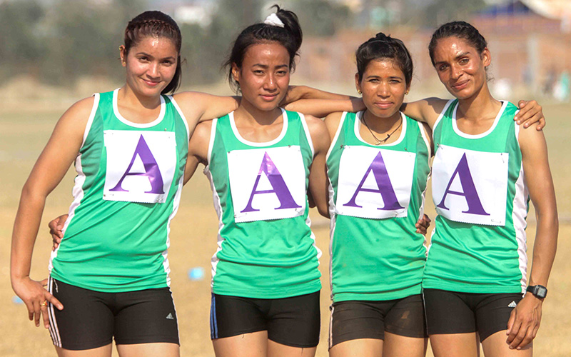 (From left) Durga Devkota, Sageeta Mechey, Krishna Chaudhary and Saraswoti Bhattarai of Tribhvaun Army Club--gold medalists of women's 4x400m relay--at the Itahari Stadium in Sunsari district, on Sunday, December 25, 2016. Photo: Udipt Singh Chhetry