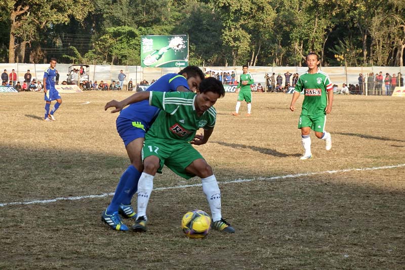 Nepal Police (Blue) and Sahara Club players vie for the ball during the 2nd International Invitational Hetaunda Gold Cup in Hetaunda, on Saturday, December 31, 2016. Photo: Prakash Dahal