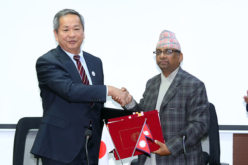 Japanese ambassador to Nepal Masashi Ogawa (left) and Secretary of the Ministry of Finance Shanta Raj Subedi sign the exchange of notes as Japan International Cooperation Agency (JICA) agrees to provide a grant assistance of Rs 692,000,000 for the project for the Improvement of Medical Equipment (PIME) in Tribhuvan University Teaching Hospital (TUTH), in Kathmandu, on Wednesday, December 28, 2016. Photo: RSS