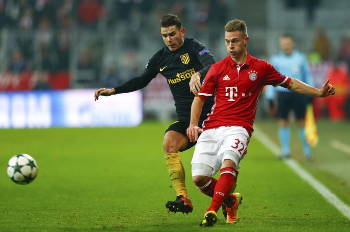 Football Soccer - Bayern Munich v Atletico Madrid - UEFA Champions League Group Stage - Group D - Allianz Arena, Munich, Germany - 06/12/16 - Bayern Munich's Joshua Kimmich in action with Atletico Lucas Hernandez.   REUTERS/Michaela Rehle