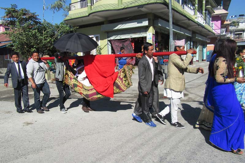 A bridegroom from the Limbu community is being taken to the bride's house in Dharan of Sunsari district, on Friday, December 9, 2016. Photo: RSS   