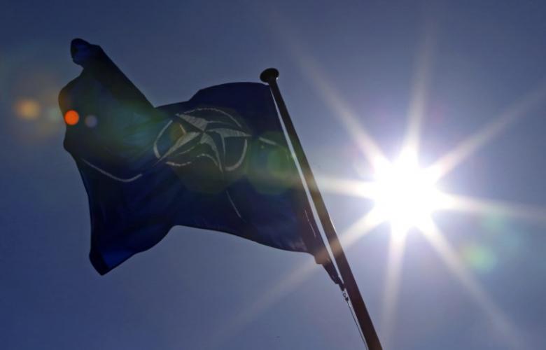 A NATO flag flies at the Alliance headquarters in Brussels during a NATO ambassadors meeting on the situation in Ukraine and the Crimea region, March 2, 2014.  REUTERS/Yves Herman