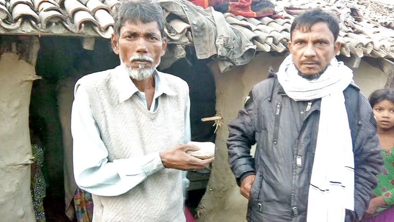 Ilahi Miya (left) returning Rs 50,000 dowry to his daughter-in-lawu0092s father after Tilak Dahej Lenden Banda campaign was launched in  Katahariya, Rautahat, on Wednesday, December 21, 2016.The campaign was launched against the dowry system. Photo: THT