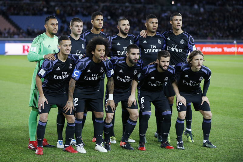 Real Madrid players pose for a team group photo before the match. Photo: Reuters