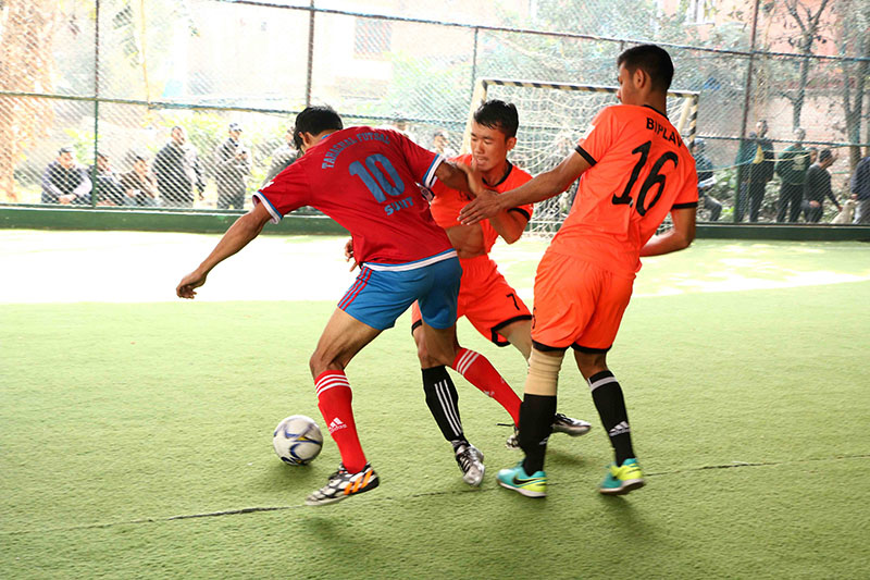 Players of Shankhamul and Tahachal (left) in action during their Red Bull Futsal League match. Photo: Suman Shrestha