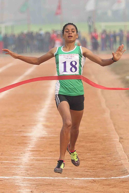 Saraswati Bhattarai of Tribhuvan Army Club reaches finish line in women's 800m final race during the 7th National Games at Itahari Rangasal in Sunsari distric on Monday, December 27, 2016. Photo: Udipt Singh Chhetry