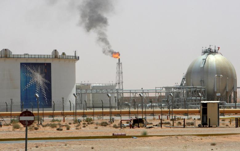 A gas flame is seen in the desert near the Khurais oilfield, Saudi Arabia June 23, 2008. REUTERS/Ali Jarekji/File Photo