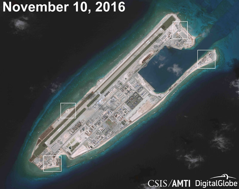 A satellite image shows what CSIS Asia Maritime Transparency Initiative says appears to be anti-aircraft guns and what are likely to be close-in weapons systems (CIWS) on the artificial island Fiery Cross Reef in the South China Sea in this image released on December 13, 2016. Photo: Reuters
