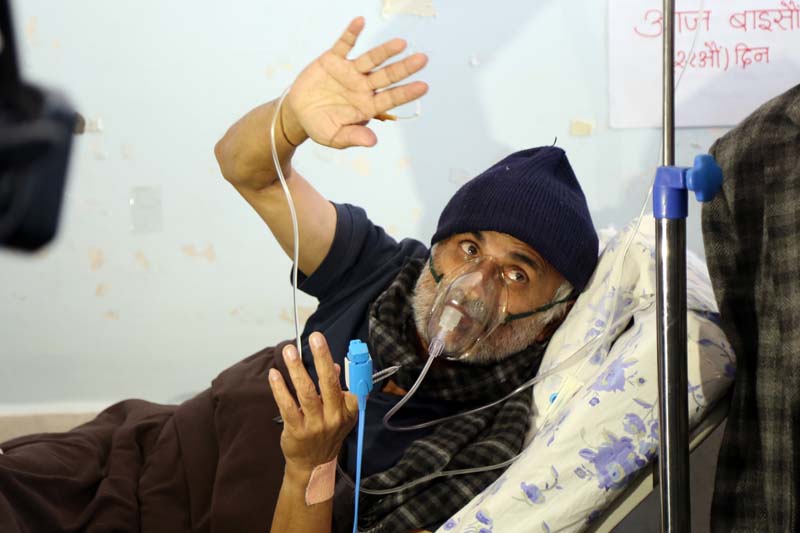 Tribhuvan University Teaching Hospital's senior orthopaedic surgeon Dr Govinda KC greets his supporters as he ends the 22-day fast-unto-death, in Kathmandu, on Sunday, December 4, 2016. Photo: RSS