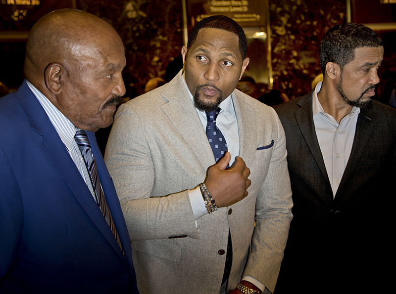 From left, football hall-of-famer Jim Brown, former football player and Ray Lewis and Pastor Darrell Scott talk to reporters in the lobby of Trump Tower in New York on Tuesday, December 13, 2016. Photo: AP
