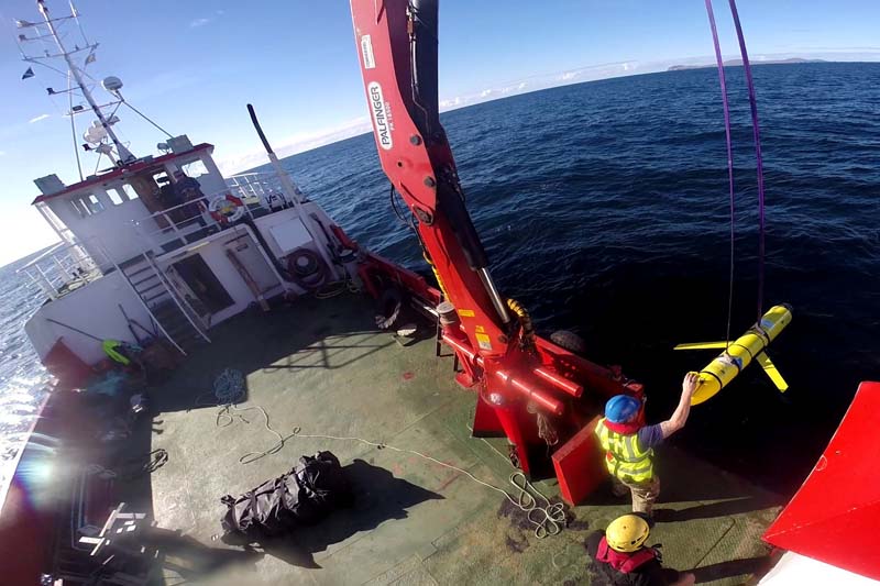 File- Crew members aboard the VOS Raasay recover US and British Royal Navy ocean gliders taking part in the Unmanned Warrior exercise off the northwest coast of Scotland, on October 8, 2016. Photo: Reuters