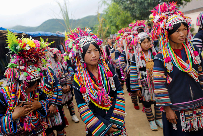 Ethnic Akha women march during a festival in a village outside Pansang, Wa territory in northeast Myanmar on October 3, 2016. Photo: Reuters