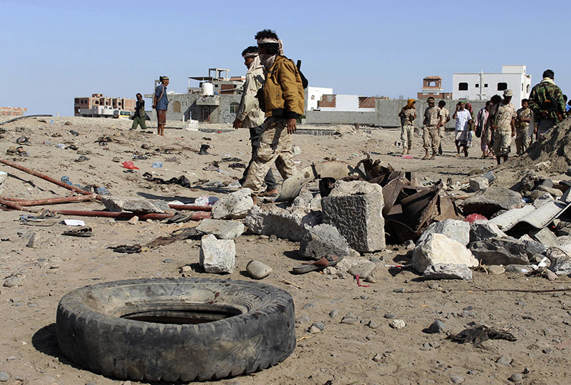 FILE - Soldiers gather the site of a suicide bomb at a base in the southern city of Aden, Yemen, on Sunday, December 18, 2016. Photo: AP