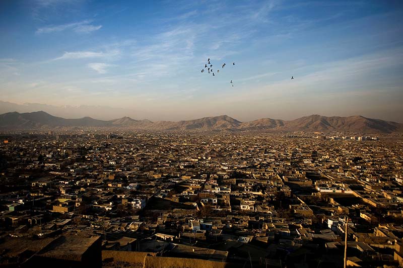 File-Birds fly over as the sun sets in Kabul, Afghanistan December 30, 2009. Photo: Reuters