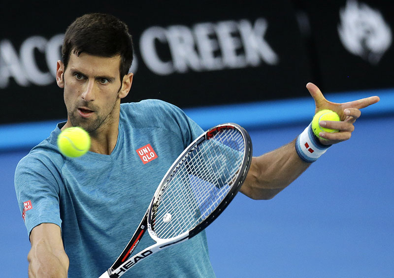 Serbia's Novak Djokovic makes a backhand return during a practice session ahead of the Australian Open tennis championships in Melbourne, Australia, on Sunday, January 15, 2017. Photo: AP