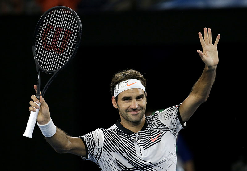 Switzerland's Roger Federer celebrates after defeating Austria's Jurgen Melzer in their first round match at the Australian Open tennis championships in Melbourne, Australia, on Monday, January 16, 2017. Photo: AP