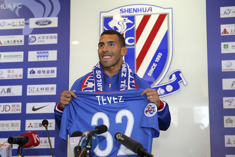Argentine striker Carlos Tevez attends his first presser after joining Shanghai Shenhua in Shanghai, China, on Saturday, January 21, 2017. Photo: Chinatopix Via AP