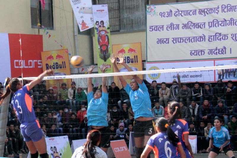 Players of Nepal APF Club (front) and Nepal Police Club in action during their 12th Blue Sky TVS Dhorpatan Women's Double League Volleyball Tournament match in Kathmandu on Monday, January 9, 2017. Photo: THT