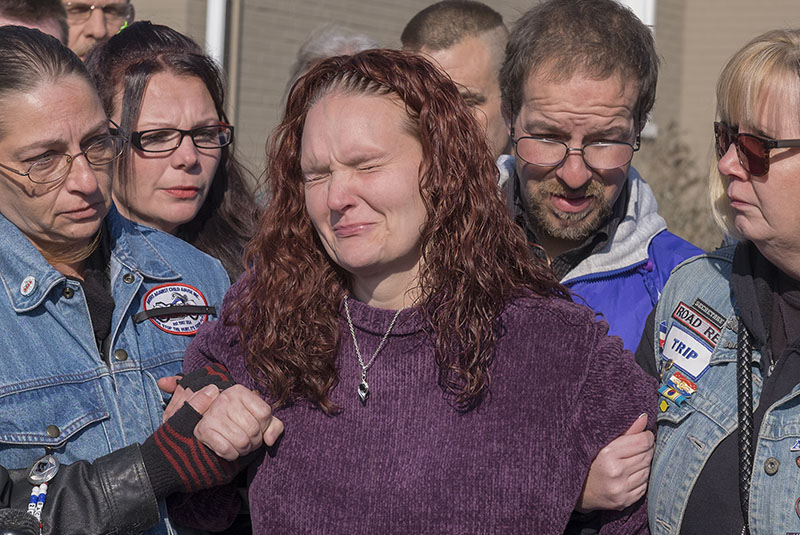 A distraught Rose Hunsicker (centre), the biological mother of Grace Packer, is escorted to the church by members of her family and members of Bikers Against Child Abuse, on Monday, January 16, 2017, on her way in to a memorial service for Packer, the local teen who authorities say was killed and dismembered by her adoptive mother and her boyfriend, at the New Life Presbyterian Church in Glenside, Pennsylvania. Photo: AP