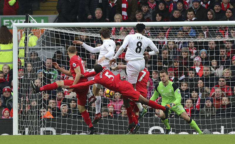 Swansea City's Fernando Llorente, (centre left), scores his side's second goal of the game during the English Premier League soccer match between Liverpool and Swansea City at Anfield, Liverpool, England, Saturday, Jan. 21, 2017. Photo: Peter Byrne/PA via AP