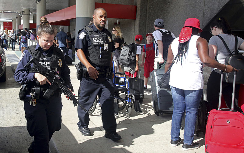 A heavy police presence was at the Ft Lauderdale-Hollywood International Airport after it re-opened, on Saturday, January 7, 2017. Investigators continued their work downstairs in the baggage area of terminal 2 the day after a shooting. Photo: Mike Stocker  /South Florida Sun-Sentinel via AP