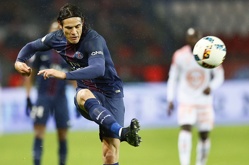 FILE - PSG's Edinson Cavani kicks the ball during their French League One soccer match between PSG and Lorient at the Parc des Princes stadium in Paris, France, on Wednesday, December 21, 2016. Photo: AP