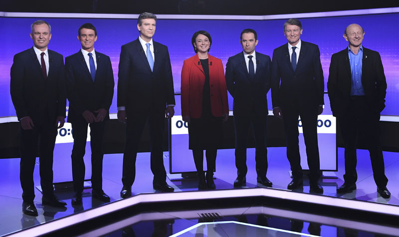 French politicians (left to right) Francois de Rugy, Manuel Valls, Arnaud Montebourg, Sylvia Pinel, Benoit Hamon, Vincent Peillon and Jean-Luc Bennahmias attend the final prime-time televised debate for the French left's presidential primaries in Paris, France, on January 19, 2017. Photo: Reuters