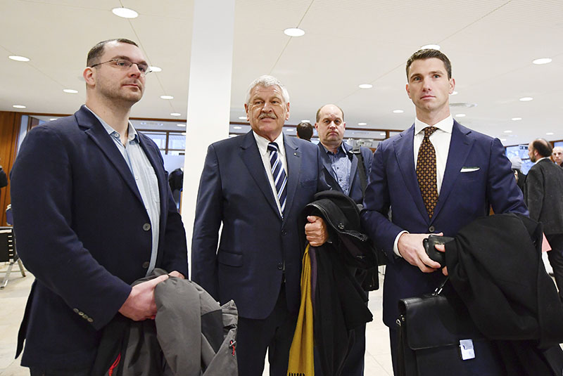 NPD party leader Frank Franz (right) NPD's member of the European Parliament, Udo Voigt, and head of the Berlin NPD Sebastian Schmidtke (left) go through the security check before the verdict to outlaw a far-right party NPD at the German constitutional court in Karlsruhe, southern Germany, on January 17, 2017. Photo: Uwe Anspach/dpa via AP