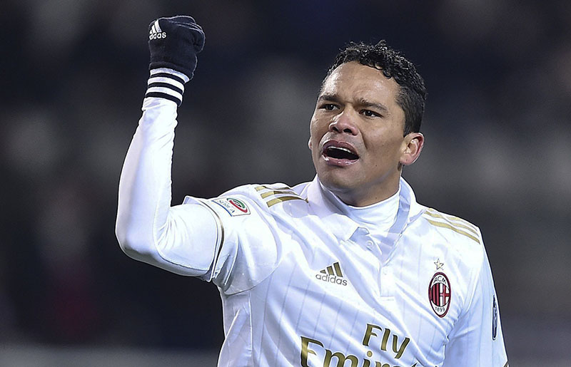 Torino's Andrea Belotti Milan's Carlos Bacca celebrates after he scored during a Serie A soccer match between Torino and Milan, at Turin's Olympic stadium, Italy, Monday, Jan. 16, 2017. (Alessandro Di Marco/ANSA via AP)