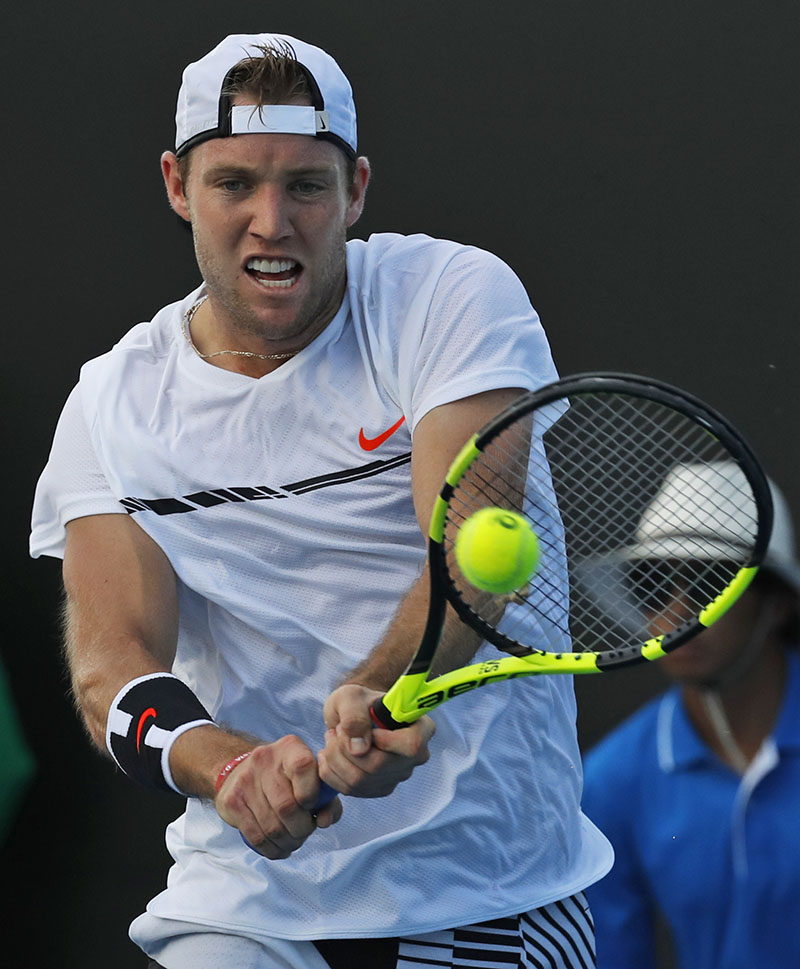 United States' Jack Sock plays a shot against France's Pierre-Hagues Herbert during their first round match at the Australian Open tennis championships in Melbourne, Australia, on Monday, January 16, 2017. Photo: AP