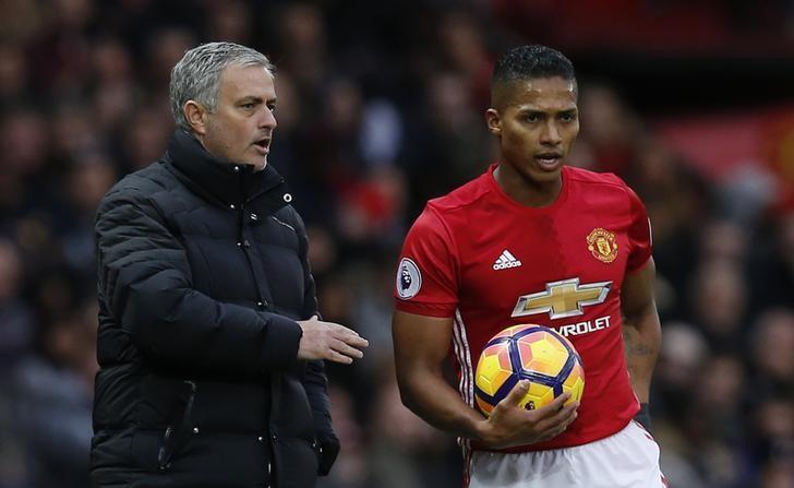 Football Soccer Britain - Manchester United v Tottenham Hotspur - Premier League - Old Trafford - 11/12/16 Manchester United manager Jose Mourinho speaks with Antonio Valencia  Reuters / Andrew Yates Livepic