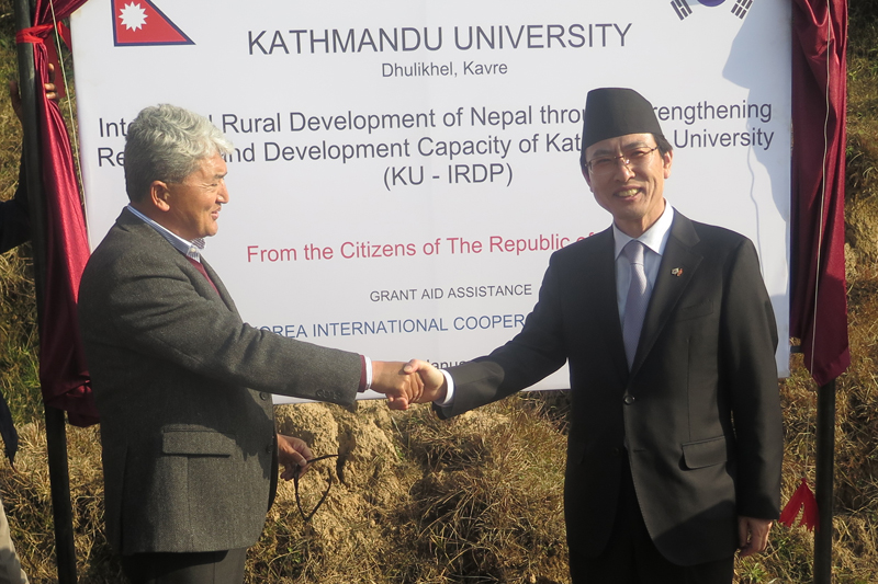 KOICA Vice-President Sung Ho Choi (right) and Kathmandu University Vice-Chancellor Ram Kantha Makaju Shrestha shake hands as thye sign an agreement for cooperation, in Dhulikhel of Kavre, on Sunday, January 22, 2017. Photo: KOICA