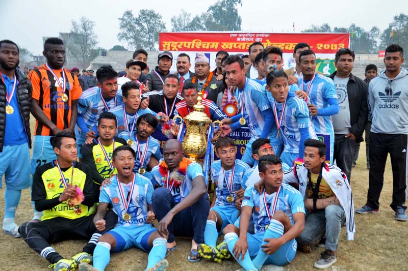 Manang Marshyangdi Club players and officials celebrate after winning the first Bhageshwor Group Far-west Khaptad Gold Cup Football Tournament at the Dhangadhi Stadium on Saturday, January 14, 2017. Photo: THT
