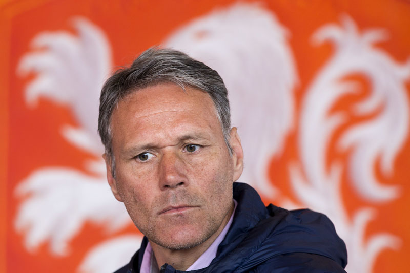 File - Dutch former soccer star Marco van Basten is seated in front of the logo of the Dutch soccer association KNVB during a presentation of video referee assistance in Amsterdam, Netherlands, on May 20, 2016. Photo: AP