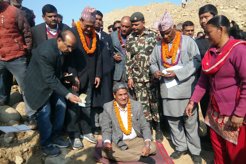 Minister for Physical Infrastructure and Transport Ramesh Lekhak (sitting) lays foundation stone for a bridge over the local Chandi stream in Rautahat district, on Monday, January 9, 2017. Photo: Prabhat Kumar Jha