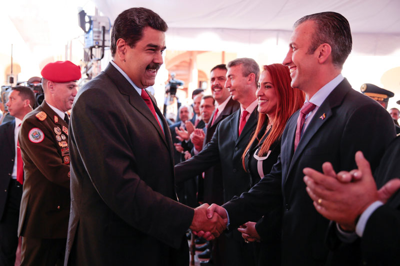 Venezuela's President Nicolas Maduro (centre) shakes hands with Venezuela's new Vice-President Tarek El Aissami (right) during a meeting with ministers at 4F military fort in Caracas, Venezuela, on January 4, 2017. Photo: Reuters