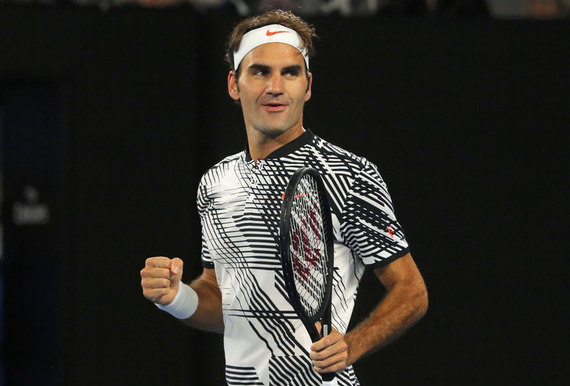 Switzerland's Roger Federer celebrates winning his Men's singles third round match against Czech Republic's Tomas Berdych. Photo: Reuters