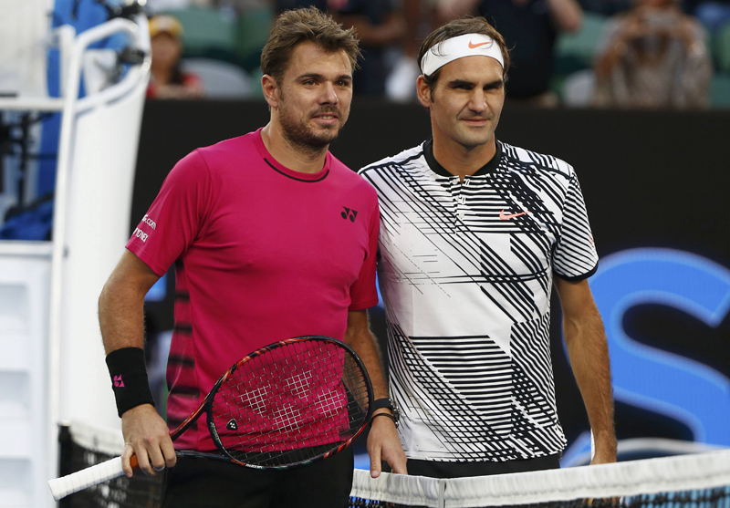 Switzerland's Roger Federer and Switzerland's Stan Wawrinka pose for photos ahead of their Men's singles semi-final match. Photo: Reuters