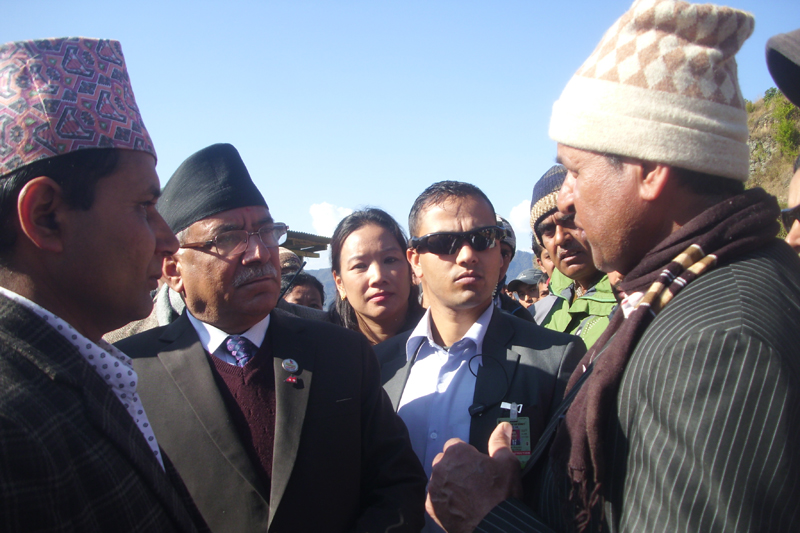 A fire victim in Sankranti Bazaar of Terhathum district talks with Prime Minister Pushpa Kamal Dahal as the latter visits the site of December 16 inferno, on Tuesday, January 3, 2017. Photo: Laxmi Gautam