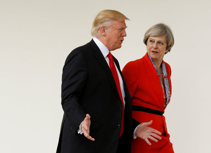US President Donald Trump escorts British Prime Minister Theresa May after their meeting at the White House in Washington, US, on January 27, 2017. Photo: Reuters