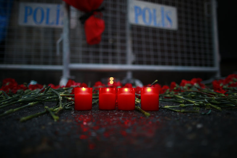 Candles are lit for the victims outside a nightclub which was attacked by a gunman overnight, in Istanbul, on New Year's Day, on Sunday, January 1, 2017. Photo: AP