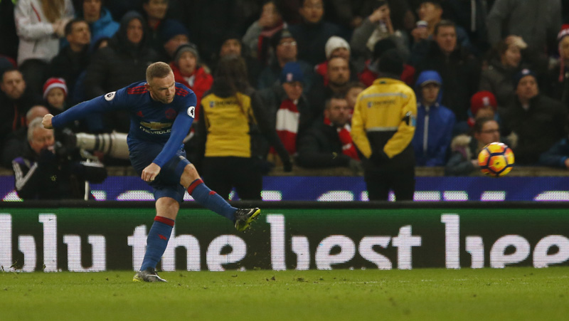 Manchester United's Wayne Rooney scores their first goal from a free kick to break the all time goalscoring record for Manchester United. Photo: Reuters