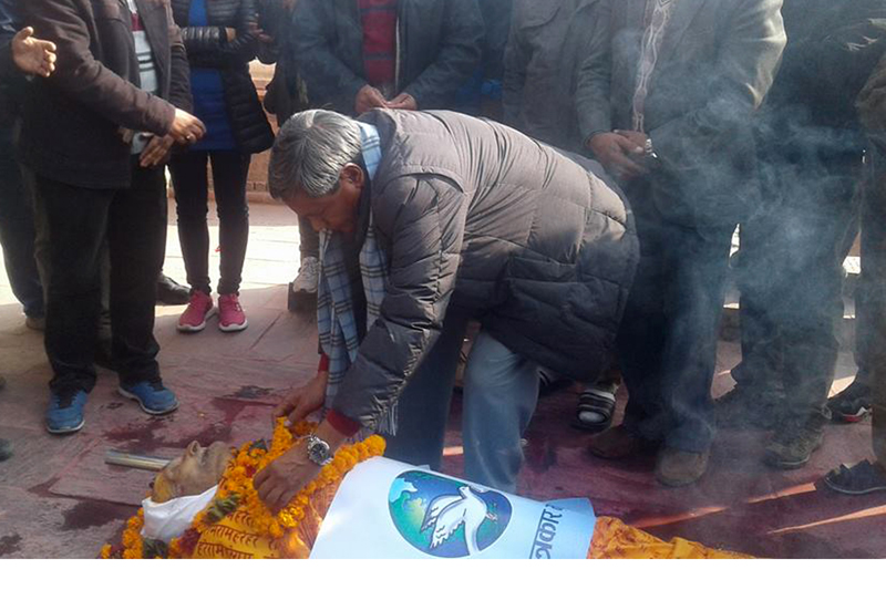 Minister for Information and Communications Surendra Kumar Karki pays final tribute to senior journalist Maniraj Upadhyay, in Kathmandu, on Thursday, January 12, 2017. Photo: RSS