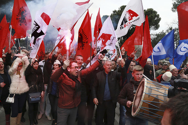Supporters of Albanian main opposition Democratic Party chant slogans during a protest in front of the government building in Tirana, on Saturday, February 18, 2017. Photo: AP