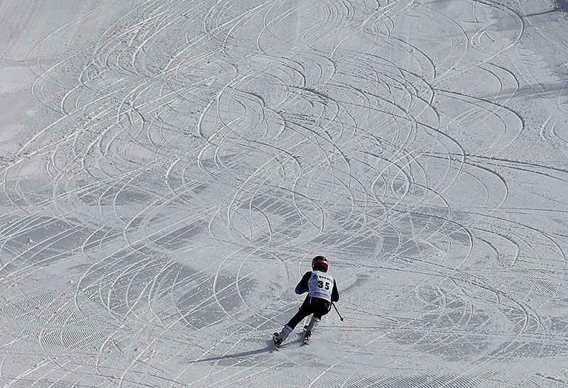 Nizomiddin Sayfiddini skies for a test run ahead of the alpine skiing men's giant slalom event at the Asian Winter Games in Sapporo, northern Japan, on Wednesday.